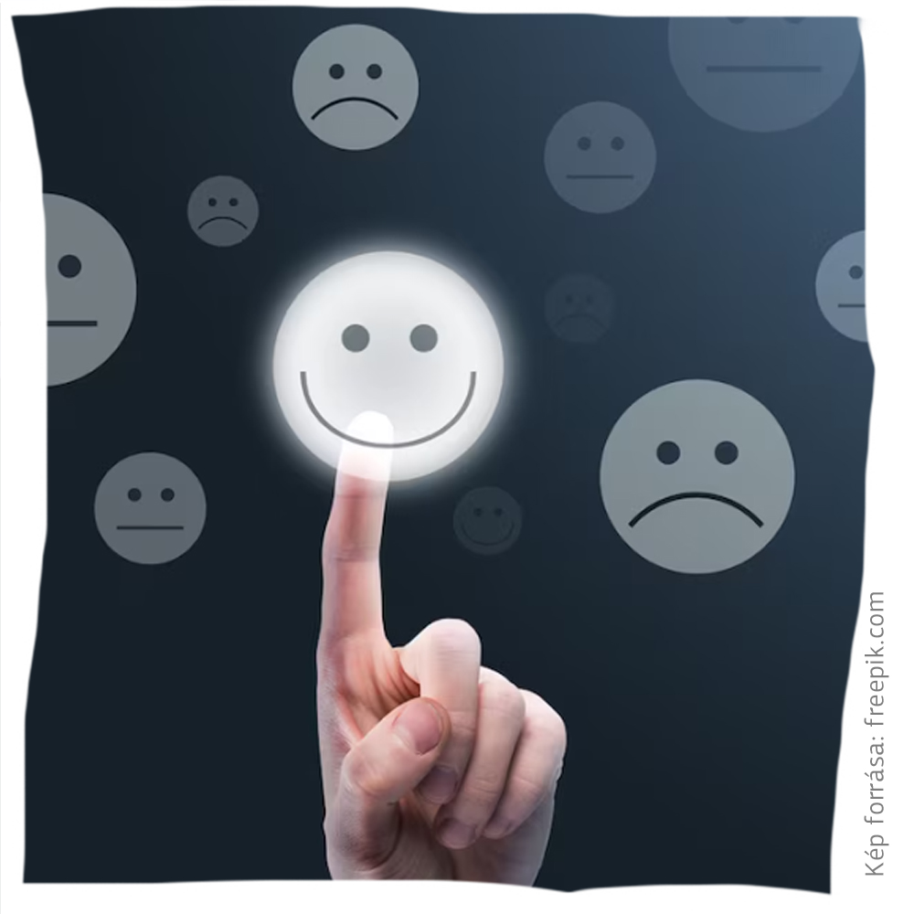 Női kéz mosolygós smiley ikonra nyom visszajelző felületen, körülötte különböző érzelmi állapotokat jelző smileyk